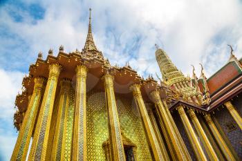 Grand Palace and Wat Phra Kaew (Temple of the Emerald Buddha) in Bangkok in a summer day