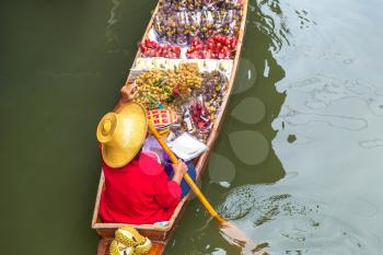 Floating market in Thailand in a summer day