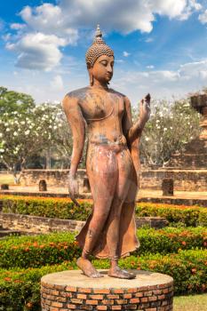 Buddha statue at  Sukhothai historical park, Thailand in a summer day