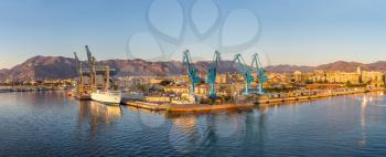 Big port cargo cranes in Palermo, Italy in a beautiful summer day