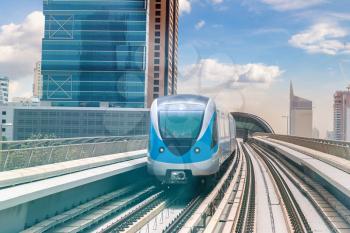 Dubai metro railway in a summer day in Dubai, United Arab Emirates