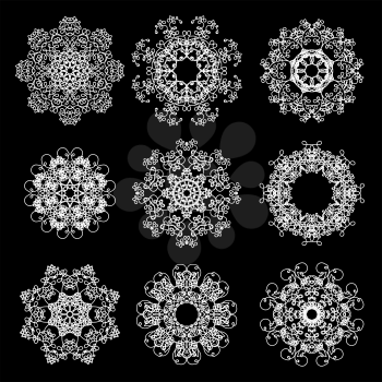 Set of Different Winter White Snowflakes Isolated on Black Backgground.