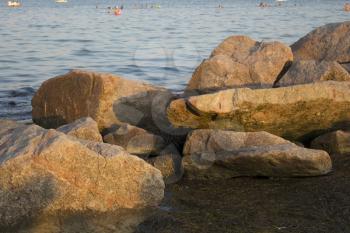 Boulders and the sea at sunset