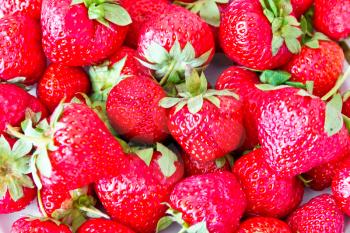 Photo of the background fresh red strawberries