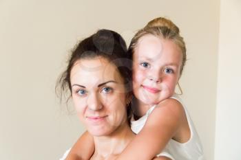 Photo of mother and daughter in white