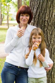 Photo of mother and daughter are eating