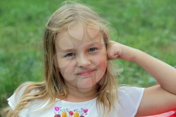 Portrait of girl with blond hair and blue eyes