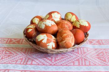 Photo of Easter eggs in wickerwork plate
