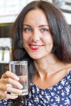 Portrait of Caucasian woman with drinking water