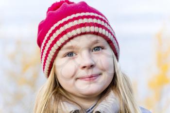Portrait of cute girl in red hat