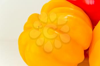 Photo of yellow raw pepper on white background