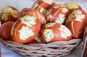 Photo of Easter eggs in wickerwork plate