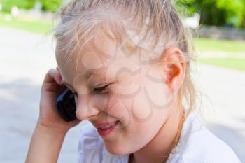 Photo of cute girl talking by cellular