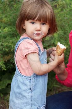 Photo of cute girl are eating icecream in summer