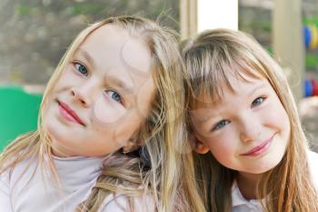 Photo of two cute girls with long hairs