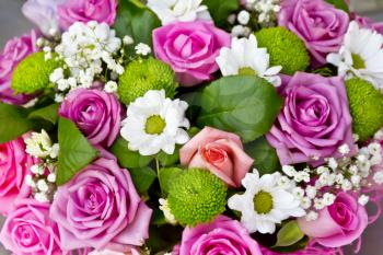 Background of pink roses and white chrysanthemums in marketplace
