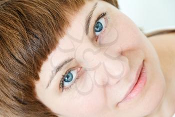 Portrait of happy woman with short brown hair and blue eyes
