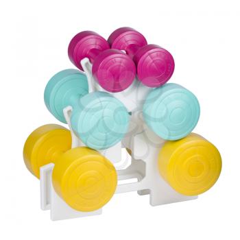 Three pairs of colorful dumbbells on plastic stand isolated on white