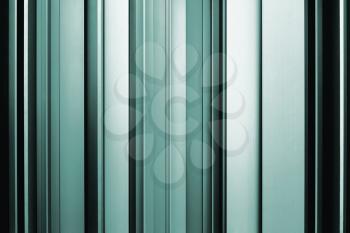 Abstract teal background, metallic texture with shadow and light.