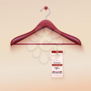 Red tag with special offer sign hanging on wooden hanger