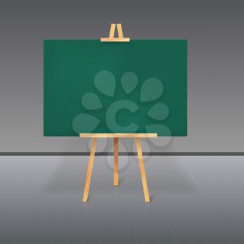 Wooden tripod with a green chalkboard standing in the room
