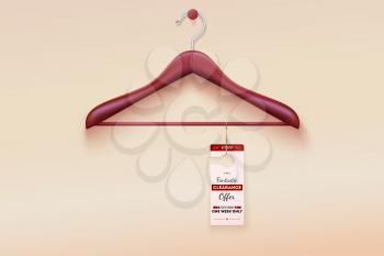 Red tag with special offer sign hanging on wooden hanger. Wooden hanger with tag and the message about the sale offers