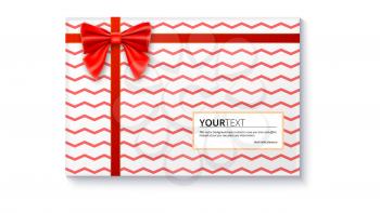 Gift box with big red bow and ribbon, isolated on white background. Top view on gift packaged in a paper with pattern