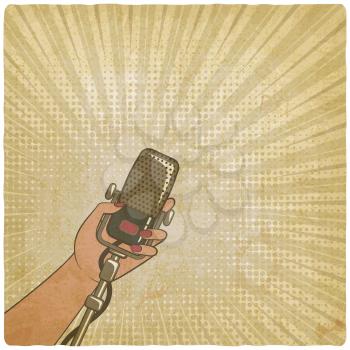 music vintage background. female hand with retro microphone. vector illustration - eps 10