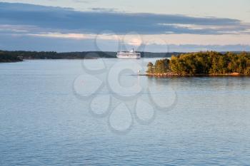 white cruise liner in Baltic sea at sunset