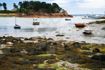 boat mooring during low tide in Ile de Brehat, Brittany, France