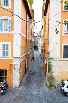 narrow medieval street in old city of Rome, Italy