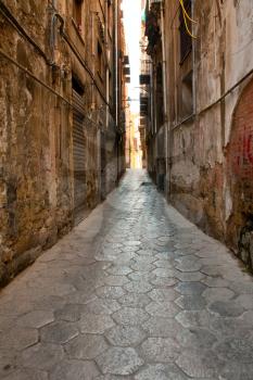 narrow medieval stone street in old Palermo, Sicily