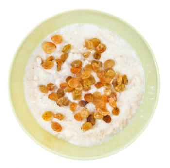 top view of traditional english oat porridge with raisins in ceramic bowl isolated on white background