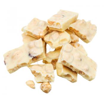 heap of broken white chocolate with hazelnuts isolated on white background