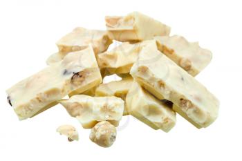 pile of broken white chocolate with hazelnuts isolated on white background