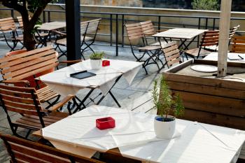 empty outdoor tables of waterfront restaurant in Berlin in autumn