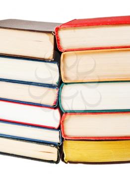 two stacks of books close up isolated on white background