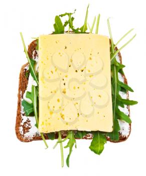 sandwich from rye bread, cheese and rocket salad isolated on white background