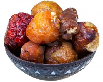 armenian candied stuffed fruits in ceramic bowl isolated on white background