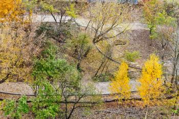 above view of walking paths in urban park in autumn