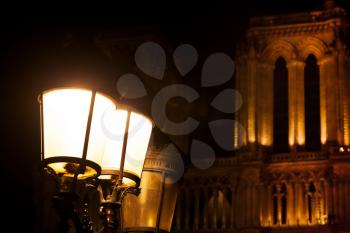 Lantern near Notre Dame de Paris at night