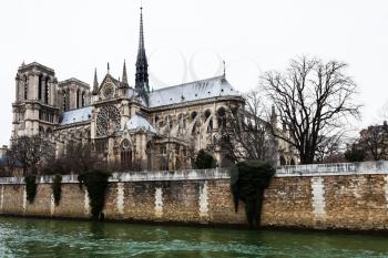 cathedral Notre Dame de Paris and Seine River in overcast day