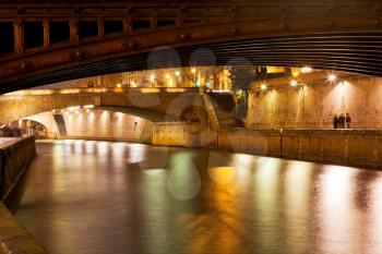 pont au Double and Seine river in Paris at night