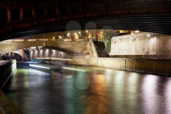 pont au Double and Seine river in Paris at night