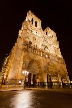 facade of cathedral Notre Dame de Paris at night