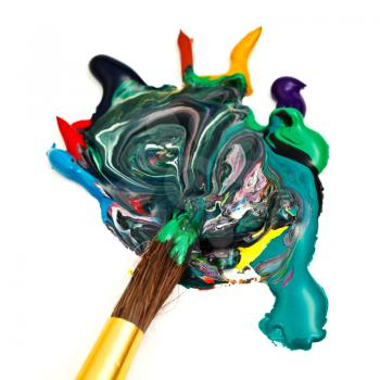 round paintbrush merges multicolored watercolor paints close up