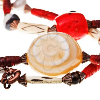 natural agate stone in string of beads isolated close up on white background