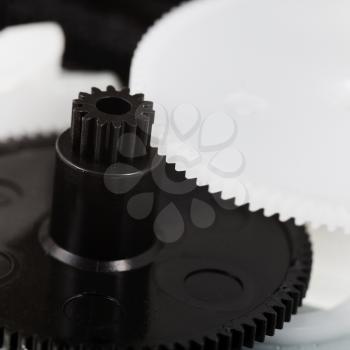 white and black plastic gears macro shot