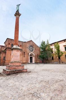 view of column with statue of Saint Dominic and Basilica of San Domenico, Bologna, Italy