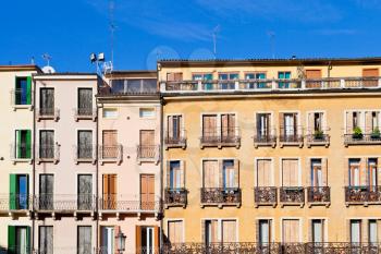 facades of medieval houses in Padua Italy under blue sky